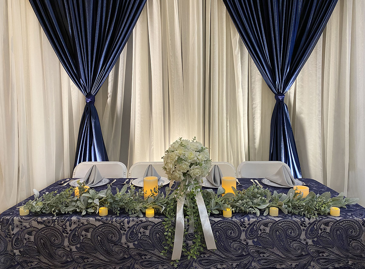 Sheer Ivory Backdrop With Polyknit Navy Front Layer V Tied