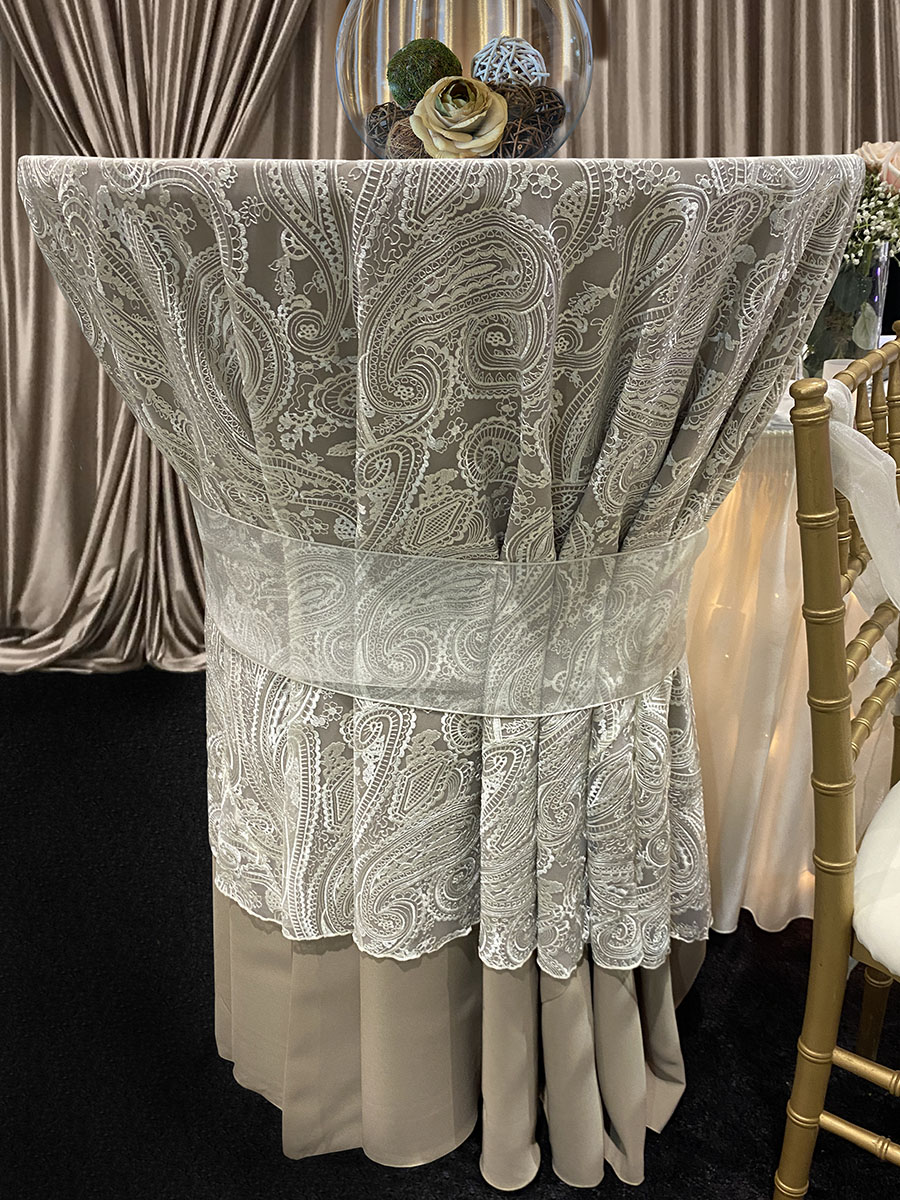 120" Round Cafe Solid Tablecover With 96" Round Ivory Paisley Lace With Ivory Organza Sash On 30" Round Cocktail Table 42" Tall